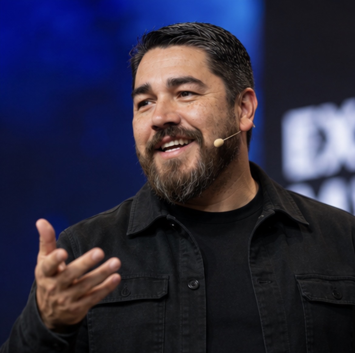 Juan Longoria speaking on stage
